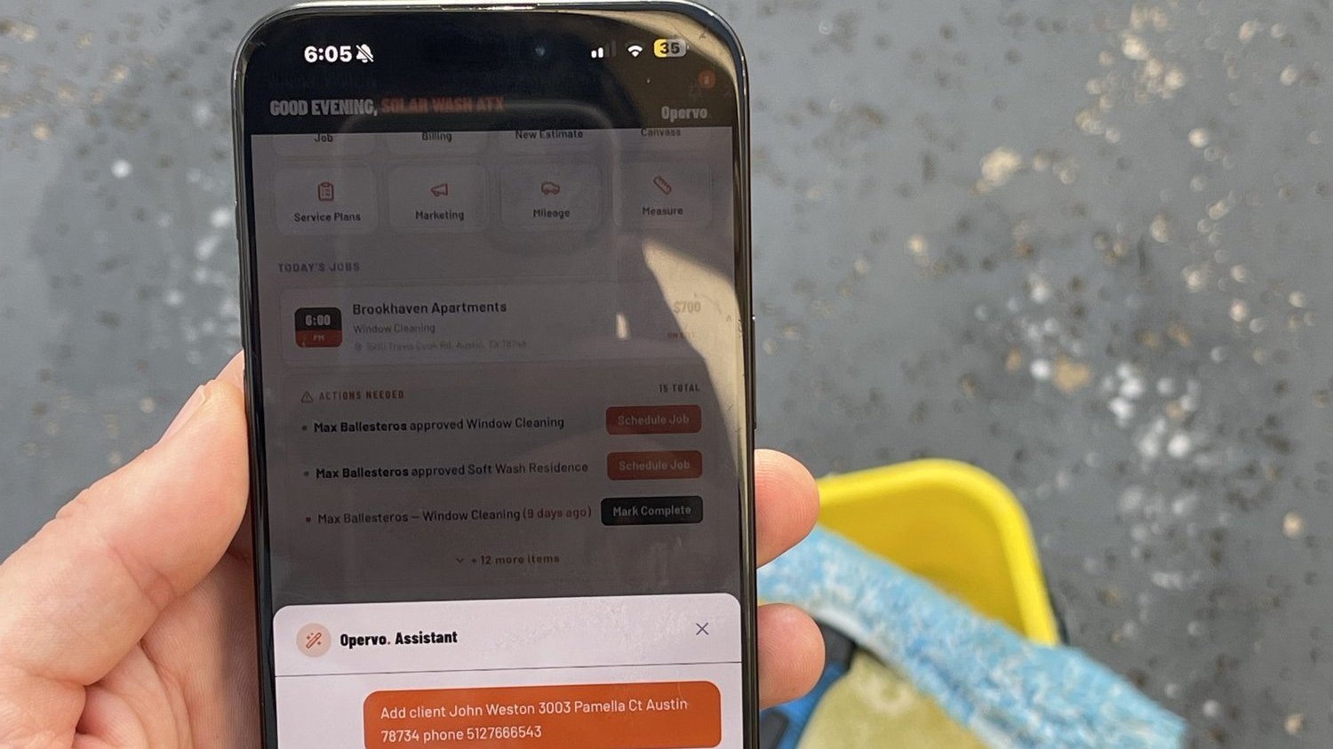 Operator answering a customer text between jobs